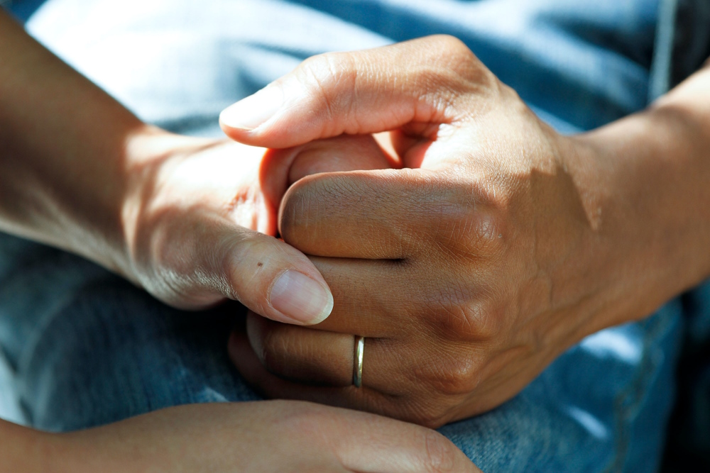 A couple holding hands.