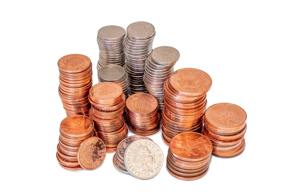 Stacks of 10p, 5p, 2p and 1p coins on a white background.