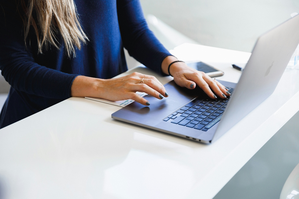 Person typing on a laptop