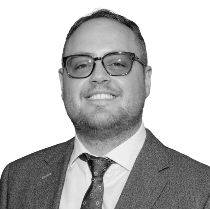 Black and white image of Solicitor James Cooper.