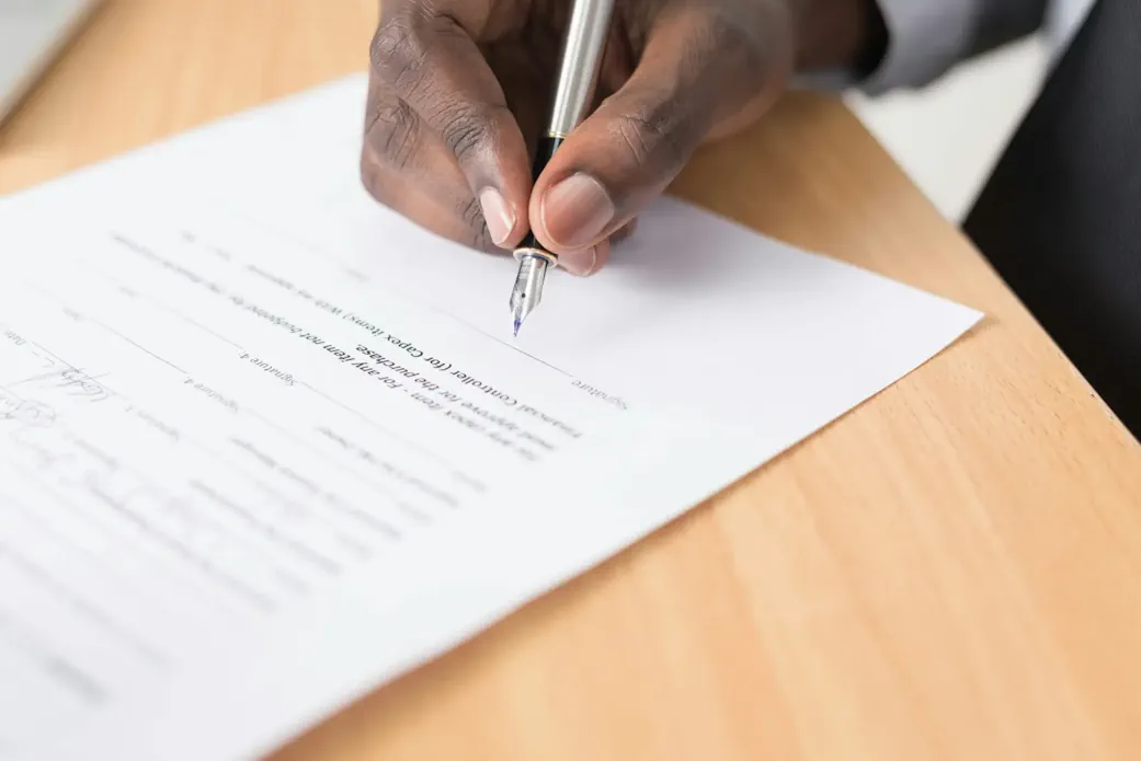 Solicitor signing a dental associate agreement.