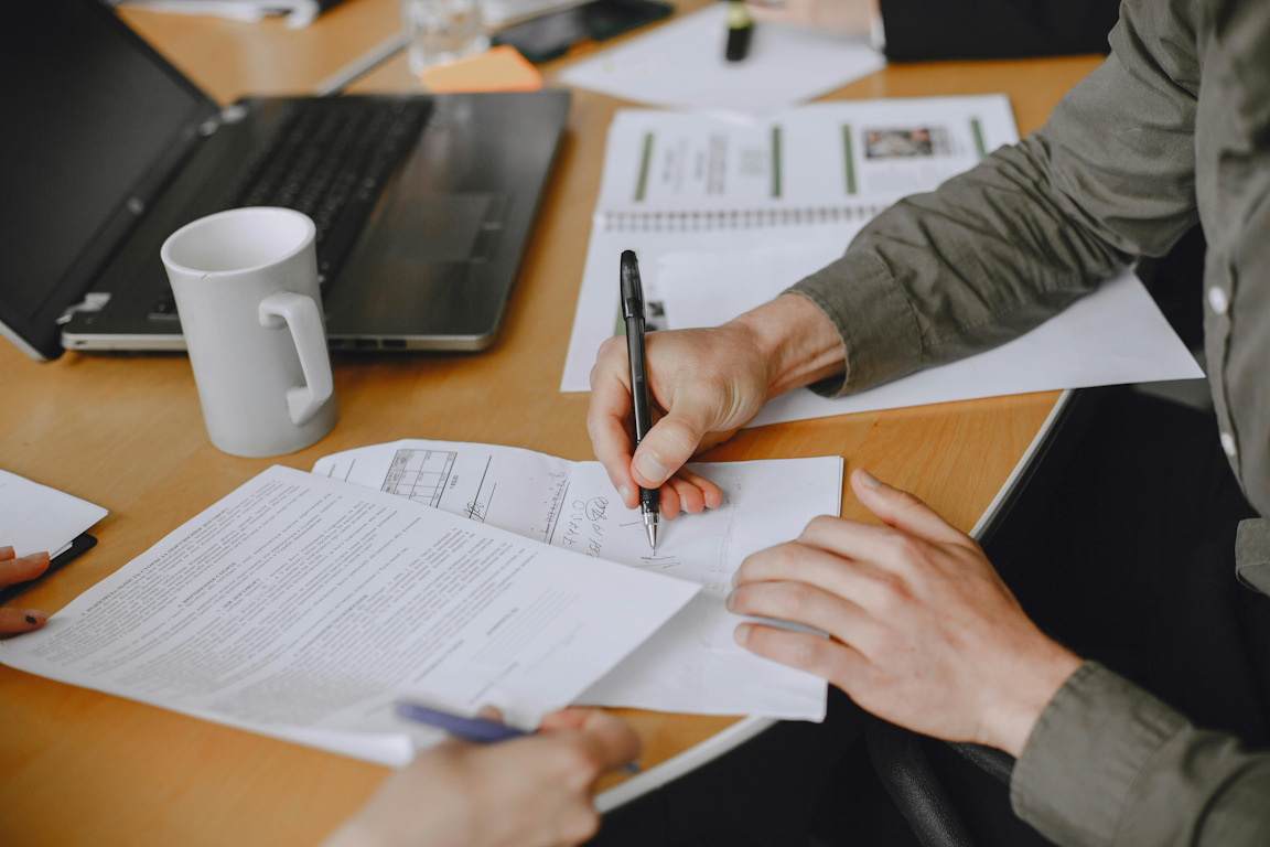 A man signs a business deal.